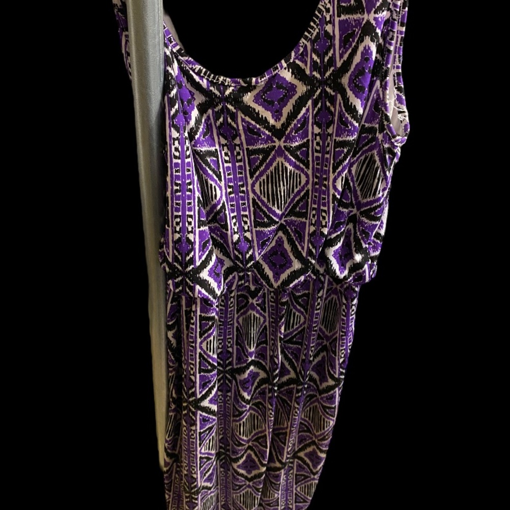 Long maxi dress with purple, black, and white, designs.